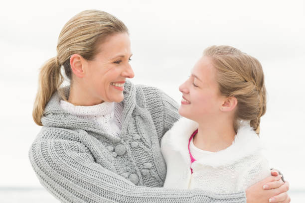 istock Mother and daughter hugging 666232378