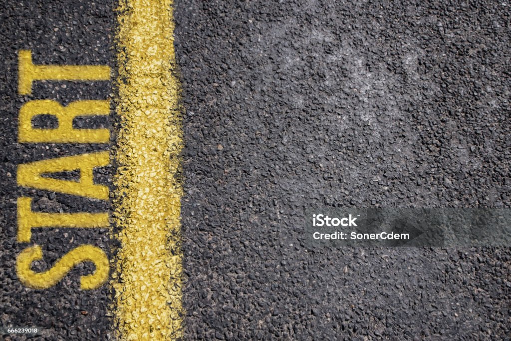 Word Start written on an asphalt road background Starting Line Stock Photo