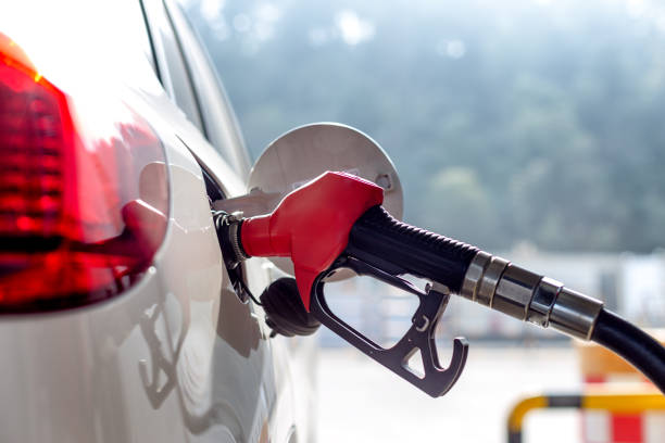 istock petrol gun with car 666242770