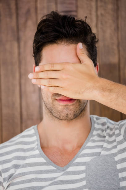 istock Handsome man covering his eyes 666248050