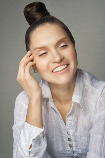 istock Laughing girl with a shingle on her head 666248334