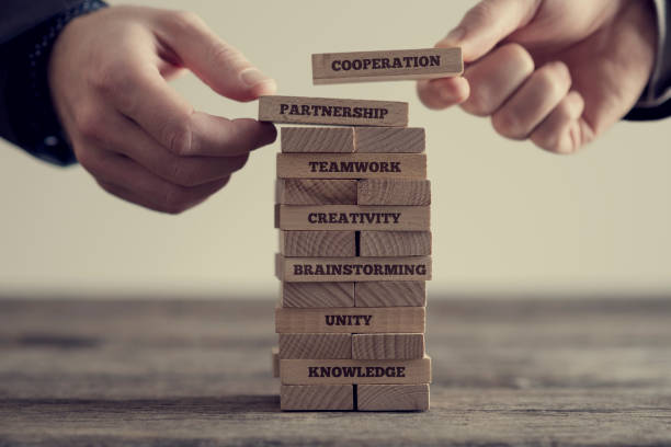 Stack of wooden dominoes with signs stock photo