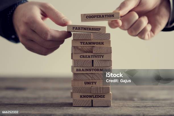 Stack Of Wooden Dominoes With Signs Stock Photo - Download Image Now - Building - Activity, Toy Block, Growth