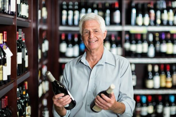 istock Smiling senior man choosing wine 666252892