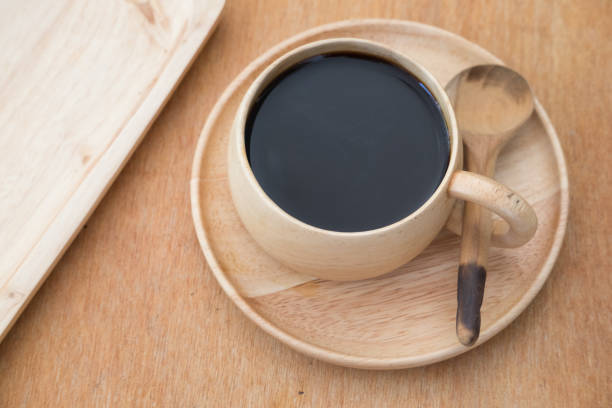 istock Cup of coffee in wood cup on wood table 666258666