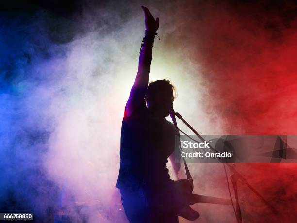 Silhouette Of Guitar Player On Stage Stock Photo - Download Image Now - Singer, Rock Music, Stage - Performance Space