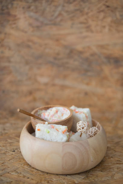 istock coleslaw sandwich on wood bowl, selective focus 666258852