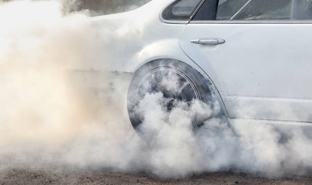 istock race car burns rubber off its tires for the race 666266520