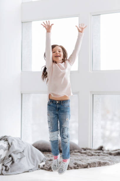 istock Happy positive girl holding her hands up 666268836