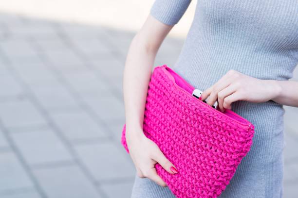 istock Fashion girl pulls the phone from handbag 666268896