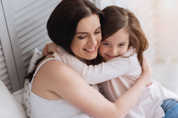 istock Happy attractive woman embracing her daughter 666273046