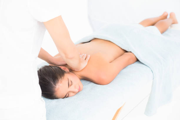 istock Beautiful brunette enjoying a massage 666279504