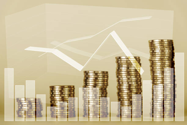 istock Double exposure of financial graph chart and rows of coins 666281248