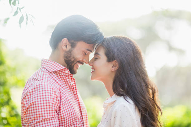 istock Happy couple leaning over to kiss 666293430