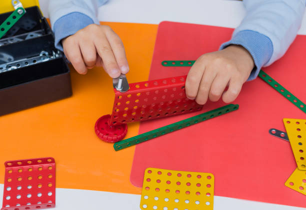 istock Little boy playing with Educational metal construction kit 666302376