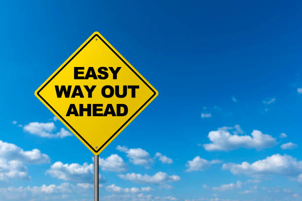 istock Easy Way Out Ahead - Road Warning Sign 666305610