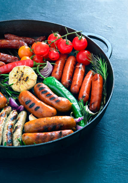 istock Grilled sausages in a pan 666306684