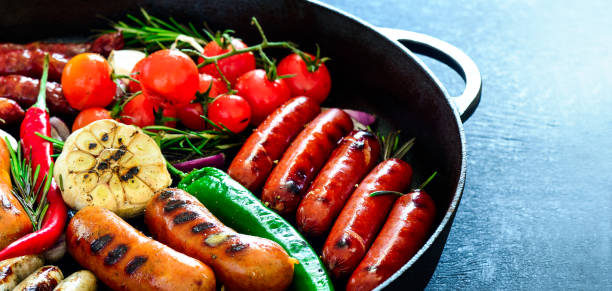 istock Sausages in a grilling pan 666306728