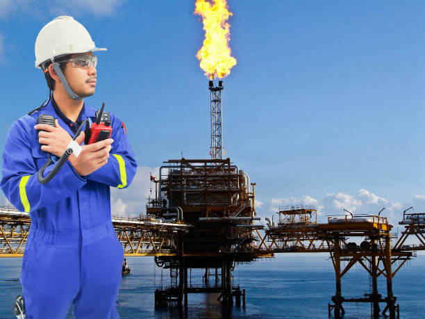 istock Working engineer at offshore oil and gas refinery 666318582