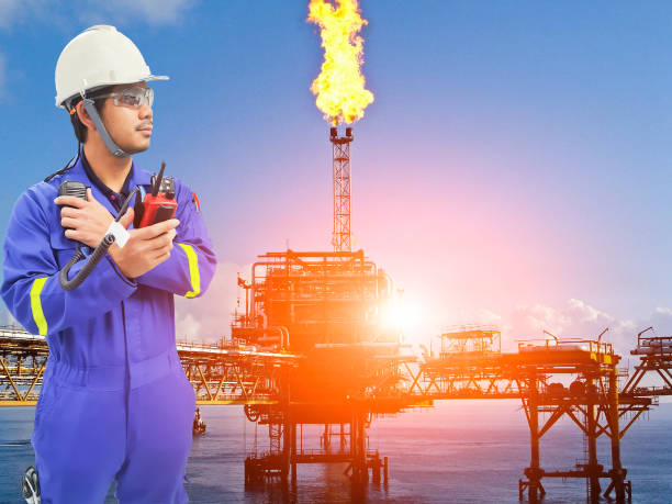istock Working engineer at offshore oil and gas refinery 666318590