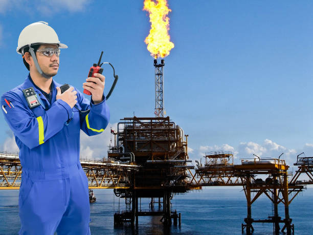 istock Working engineer at offshore oil and gas refinery 666318600