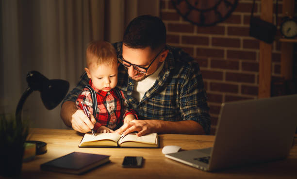 istock father and son baby work at home 666319786