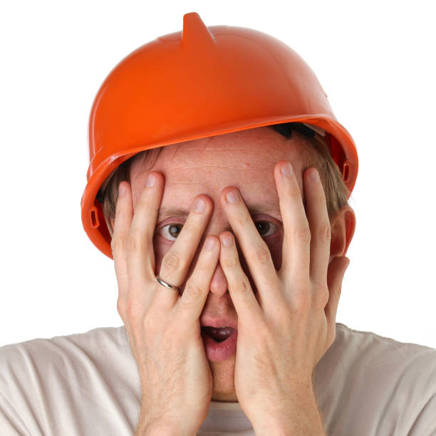 istock Shocked and surprised builder craftsman isolated on a white background 666322960