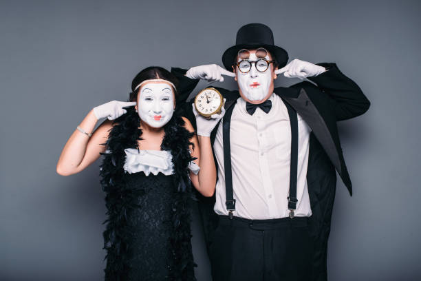 istock Pantomime actors performing with alarm clock 666323580