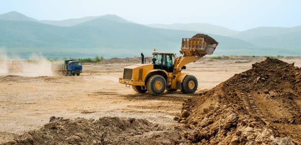 istock Earthwork, working machinery on a summer day 666329922