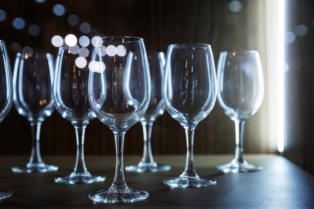 istock Empty glasses on wooden counter closeup 666335606