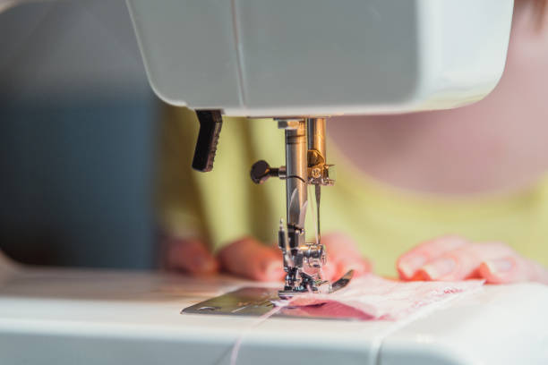 istock A sewing machine, sew. Woman sews on the sewing machine. 666336358