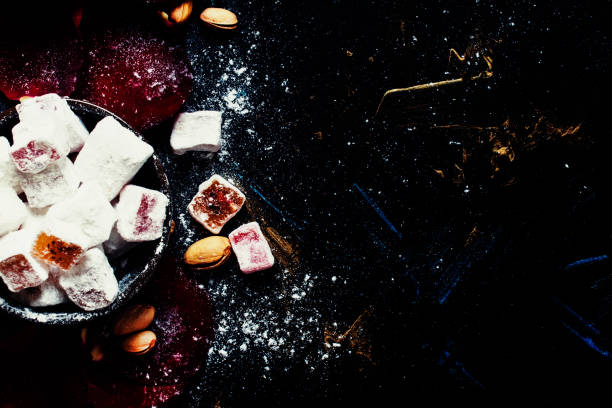 istock Eastern sweets with sugar powder, pistachios and rose petals 666336802