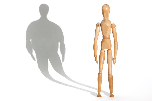 Anorexia Slender mannequin depressed because his distorted fat body shadow distorted image photos stock pictures, royalty-free photos & images