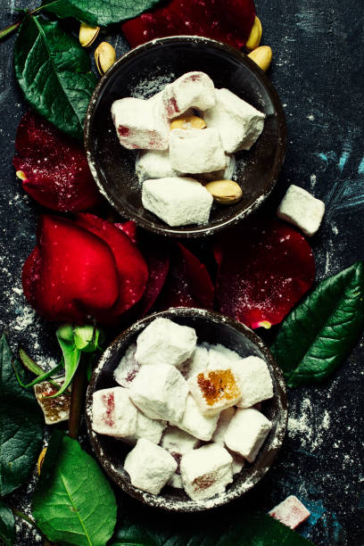 istock Eastern sweets with sugar powder, pistachios and rose petals 666342940