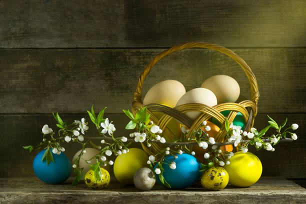 istock Easter still life with colorful eggs on an old wooden background 666343446