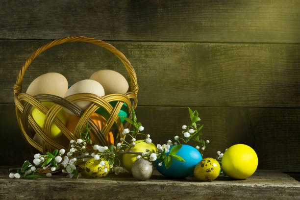 istock Easter still life with colorful eggs on an old wooden background 666343522