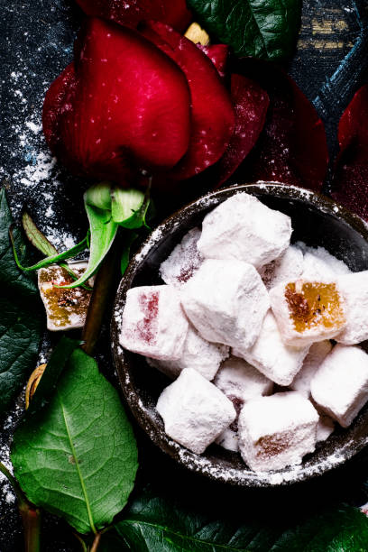 istock Eastern sweets with sugar powder, pistachios and rose petals 666343558