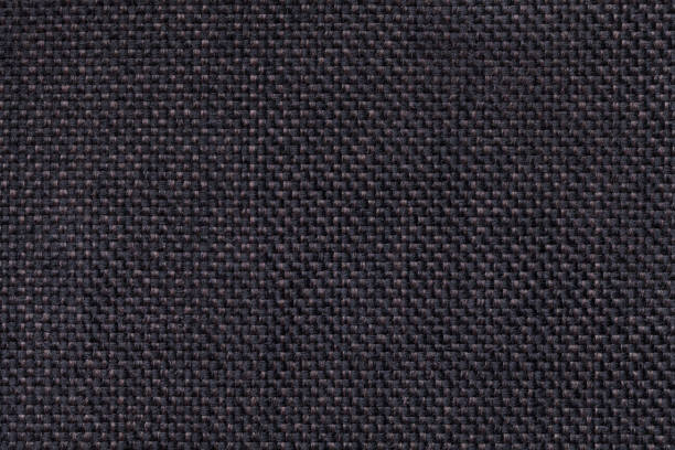 Dark black textile background closeup. Structure of the fabric macro Dark brown textile background closeup. Structure of the black fabric with chess pattern, macro. linen flax textile burlap stock pictures, royalty-free photos & images