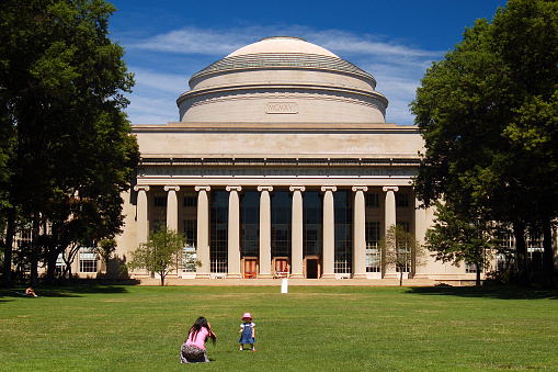 Cambridge, MA, USA August 8, 2007 A mother and daughter play on the lawn in front of the Great Dome of the Massachusetts Institute of Technology in Cambridge