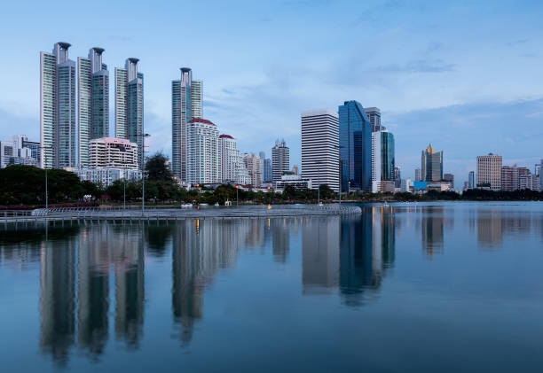 istock Twilight city office building with water reflection 666352952