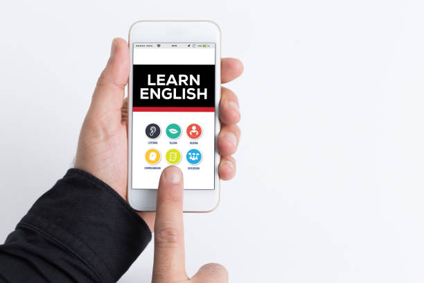 istock Hand holding smartphone and showing Learn English concept 666359554