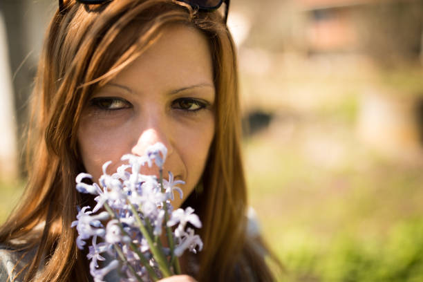 young woman gathering hyacinths