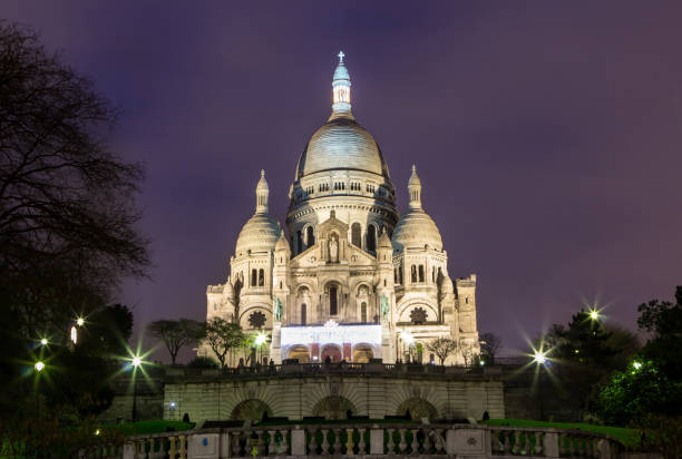 Evening view of Basilica Sacre Coeur in Montmartre in Paris, France