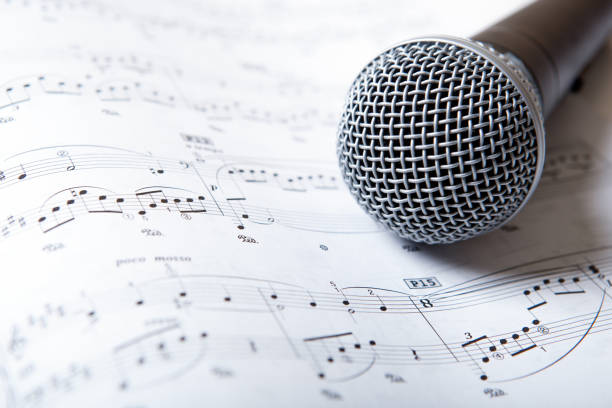 istock microphone lies on the music book 666363196