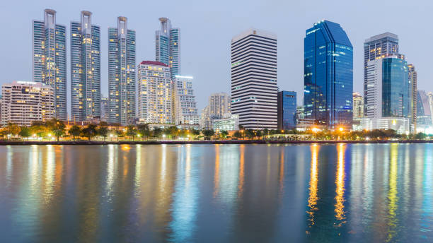 istock Office building cityscape downtown with water light reflection 666365002