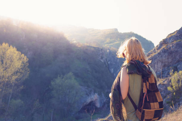 istock Young hipster girl on viewpoint lookin at sunset 666366464