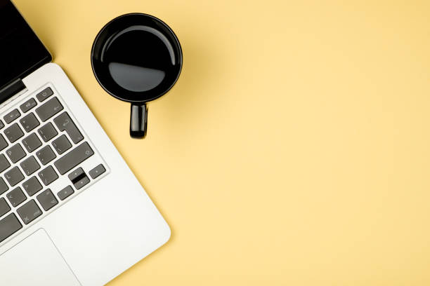 istock Creative design mockup set of workspace desk with cup of coffee and notebook. Copy space colored background 666366676