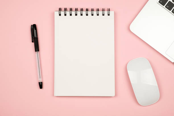 istock Top view flat lay picture with blank notepad page and different accessories on colored surface 666366714