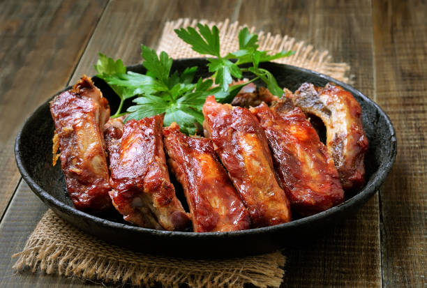 Roasted pork ribs Roasted pork ribs in frying pan barbecue pork stock pictures, royalty-free photos & images