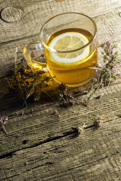 istock Herbal tea with thyme over wooden background 666368270